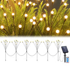 Warm white solar garden ball lights illuminating a pathway